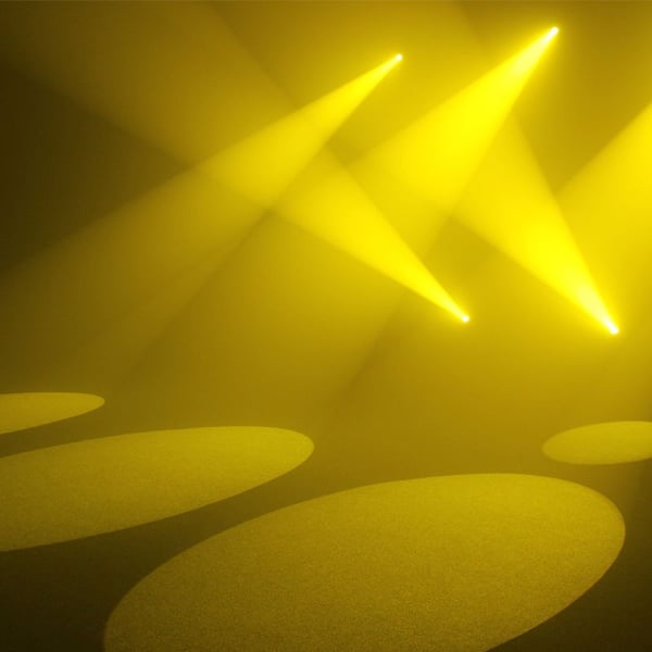 Yellow stage lighting creating dynamic patterns on event floor, highlighting AV production capabilities.