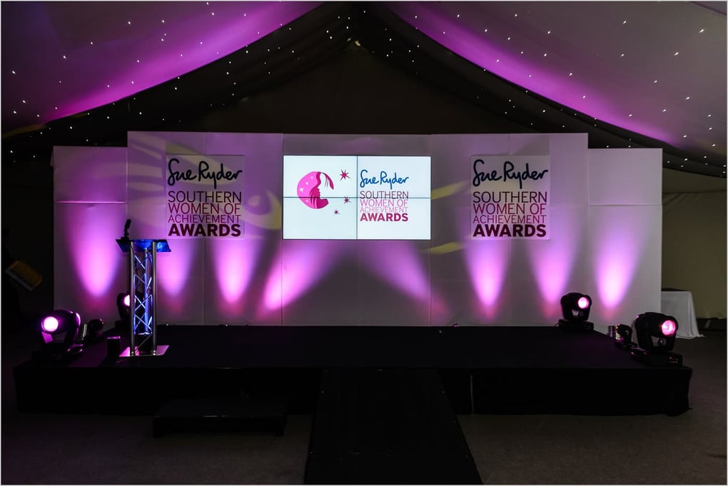full audio visual production, videowall hire, 2x2, set hire and design crystal white purple up lighting charity event, charity fundraiser, trunkwell house reading berkshire near newbury theale paddington